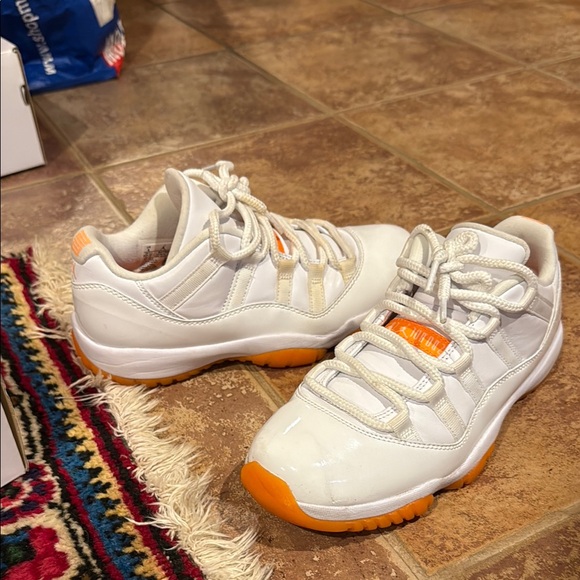 jordans 11 orange and white